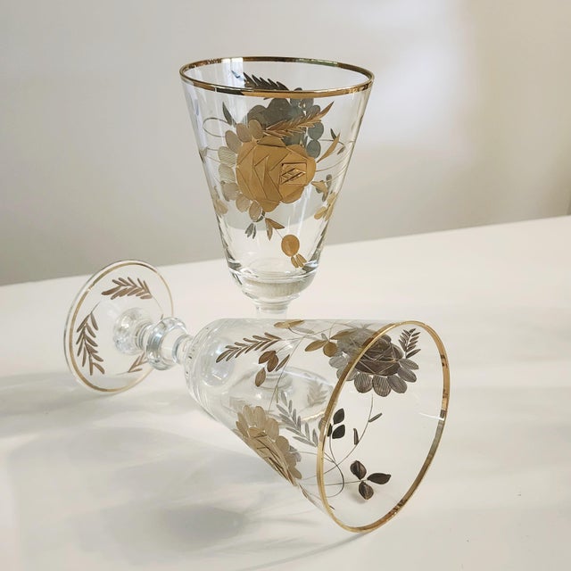 Claret Wine Glasses Set of 14 Gold Encrusted Rose-Vine Pattern Circa 1960s Hand blown crystal glassware of unknown origin...