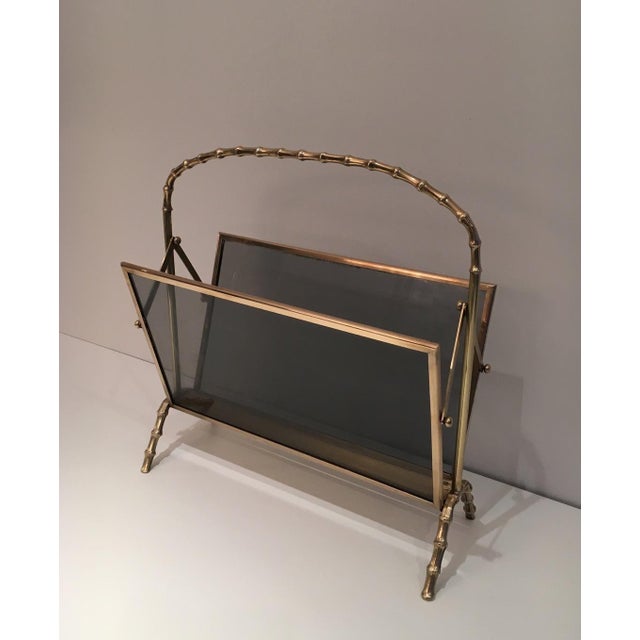 This beautiful faux bamboo magazine rack is made of bronze with greenish glass panels on each side. It is a French work...