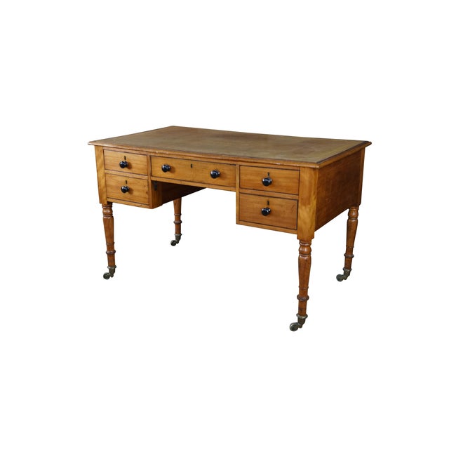This exceptional antique English Regency style dual-sided partner's desk showcases premium 19th-century cabinetmaking...