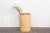 A large vintage wood pot with a clean bleached finish and irregular cylindrical shape. This rustic tall planter is hand-...