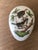 This Herend porcelain egg is part of the handpainted Rothschild Bird collection (RO). The top of the egg features two...