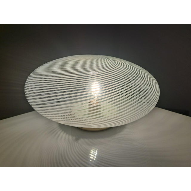 Large murano glass ceiling lamp, with a minimalist mcm design, vintage from the 1960s. the white glass lampshade, with its...