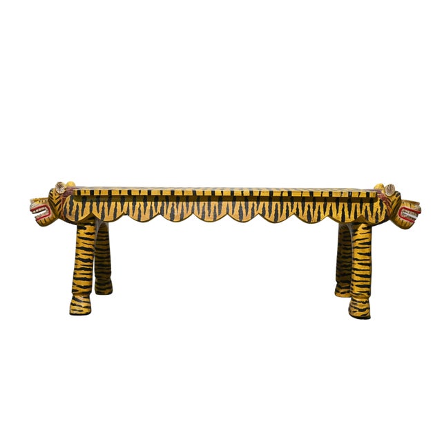 Bring home a statement piece that’s as much art as it is furniture. This hand carved wooden tiger bench console table is...