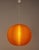 1970s Textured orange plexiglas pendant Light A beautiful spherical pendant light from the 1970s, featuring an orange...