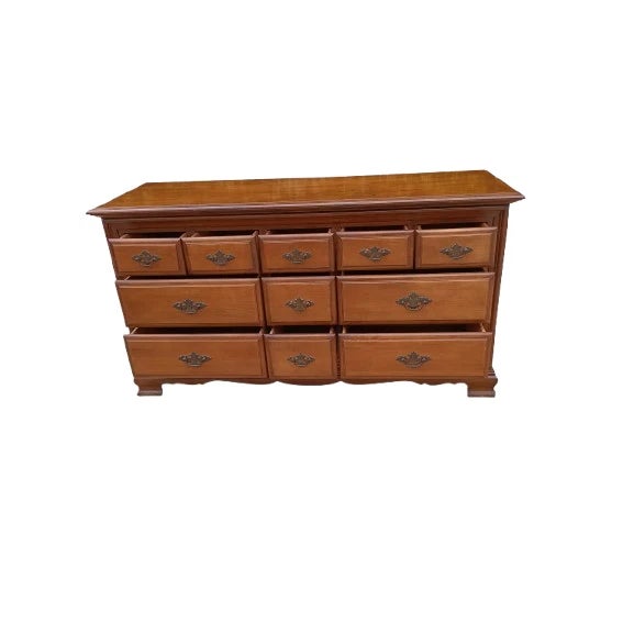 This vintage wood Ethan Allen dresser with 11 drawers is a classic addition to any bedroom. The rectangular shape, brown...