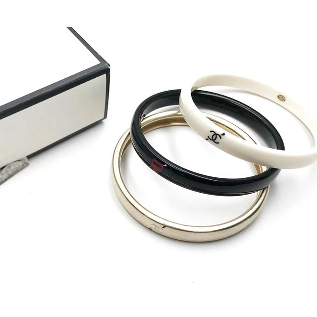 Chanel Gold Ivory Black Love Arrow CC Bracelet Bangle *Marked 10 *Made in Italy *Comes with original box -Approximately...