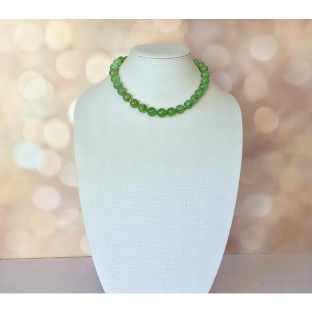 The length of the necklace is 18 inches (45.7 cm). The size of the smooth, high-quality round beads is 14 mm. The color of...