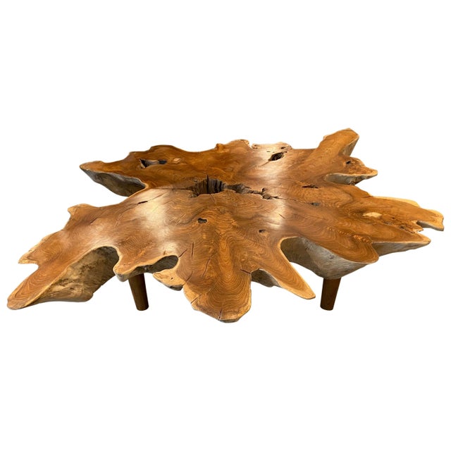 Impressive seven inch reclaimed teak coffee table with a polished top and the sides left natural in contrast. Floating on...