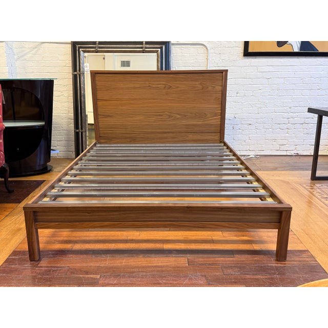 Design Plus Gallery presents the Queen Size Emerson Bed Frame from Room & Board. This bed frame has a broad paneled...