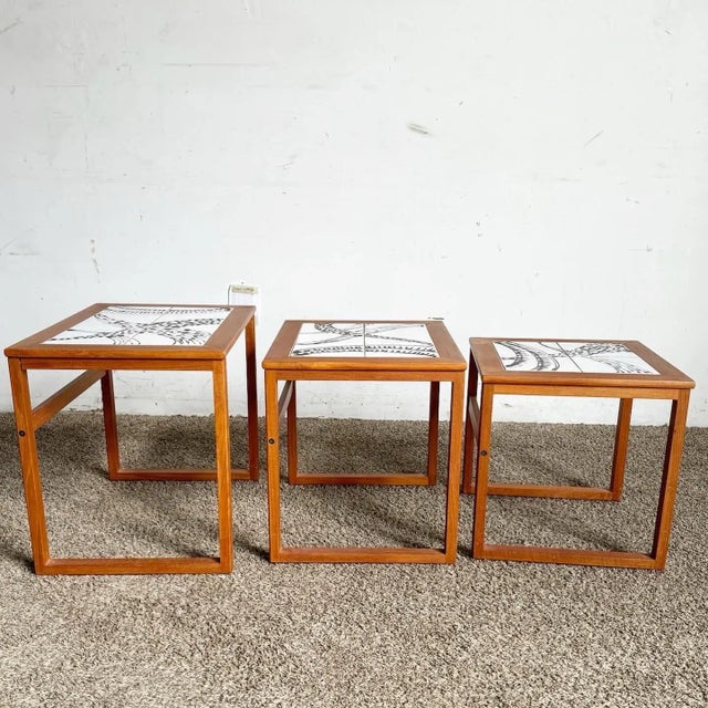 Add a touch of Scandinavian elegance to your home with the Danish Modern Nesting Tables by Mobelfabrikken Toften. These...