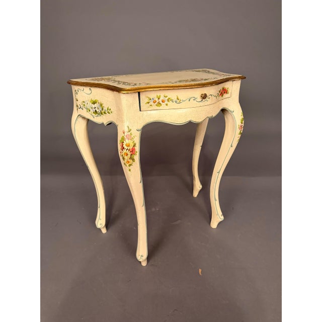 Italian polychrome side table with drawer dating to the early 20th century, circa 1920s. The table features a vibrant...