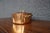 Copper stock pot with a fitted lid and solid brass side handles and lid pull. The interior is lined with stainless steel,...