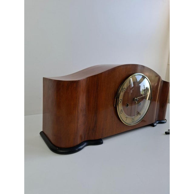 An elegant Art Deco mantel clock produced in Czechoslovakia circa 1930. Crafted from wood with a beautifully figured...