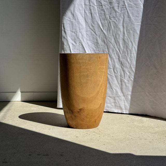 Stool, side table, or end table in natural cylindrical solid mango wood. This modular piece of furniture features a...