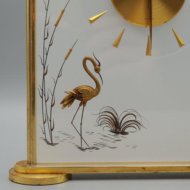 A 'marina' mantel clock by jaeger lecoultre with inset brass decorating and original 8 day movement. Stamped 'marina' to...