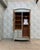 This elegant art nouveau wardrobe captivates with its delicately curved lines, its glazed door with small panes, and its...