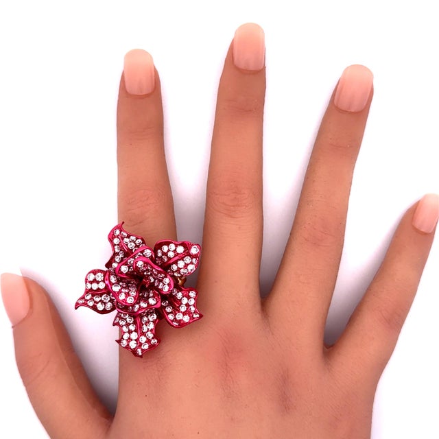 A striking fashion ring adorned with 5.52 carats of round-cut white diamonds. The vibrant sparkle of the diamonds is set...