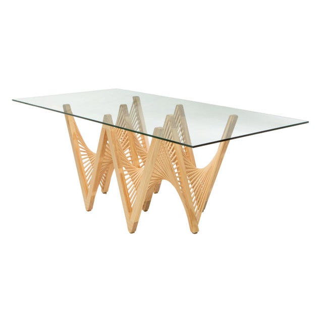 This sculptural dining table base weaves Lauan wood into an interlocking geometric web, a Mid-Century Modern statement...