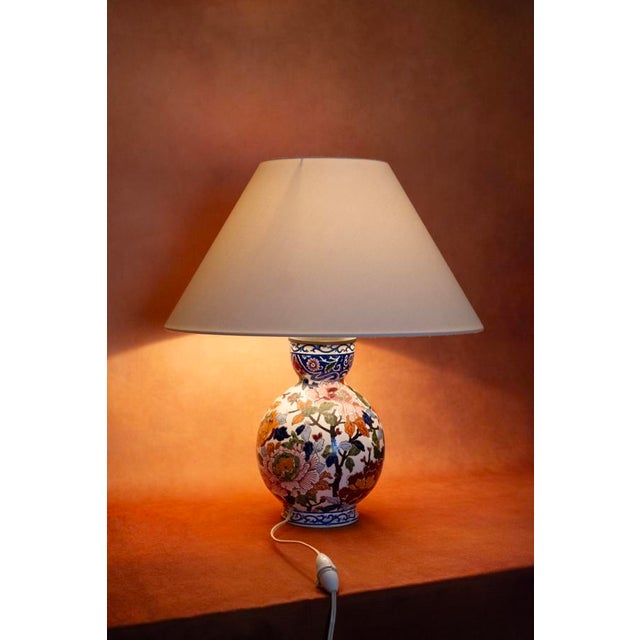 Fine white earthenware, fired at 1150°c, hand-painted decoration using the factory's traditional technique: peony motif on...