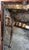 Custom made Venetian mirror, hand carving in Murano glass surrounded by wood. Antiqued silver glass.