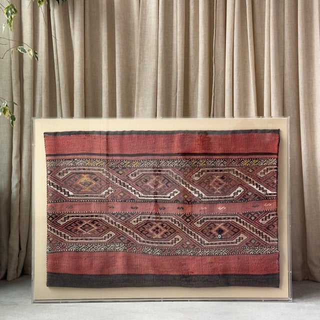 Vintage tribal textile from Turkey featuring an intricate geometric design in red, black white and yellow. Professionally...