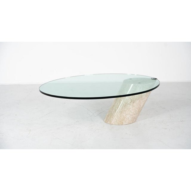 Model K1000 Travertine & Glass Coffee Table By Team Form This piece is attributed to the mentioned designer/maker. It has...