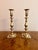 Large quality pair of brass antique candlesticks, having a quality pair of large brass candlesticks with turned shaped...