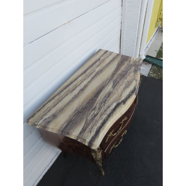 This classic Dresser is made out of wood, solid wood, walnut, veneer, metal, and marble. This Commode was made in the...