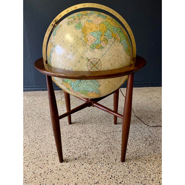 Solid walnut frame with a illuminated globe with a touch sensor to change the brightness of the globe. Replogle famous for...