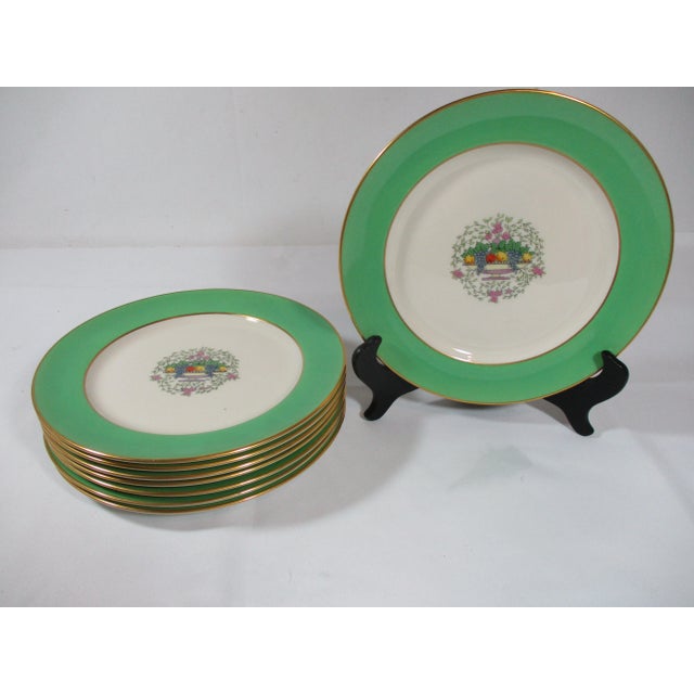 Set of eight antique Lenox Sumerset Green luncheon plates. They are decorated with an urn filled with fruit and flowers in...