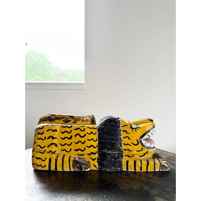 Whimsical and charming, hand-carved and hand-painted Folk Art lion sculpture. Vivid canary yellow paint with natural age-...