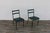 Stunning pair of original 1950s French chairs by Jacques Adnet, featuring beautifully aged green leather paired with...