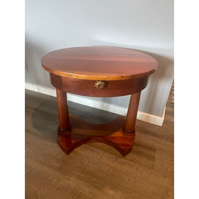 This is a stunning French Empire-style mahogany side table, ideal for adding classic elegance to any living space. The...