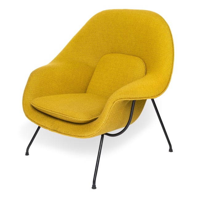 A striking contemporary photograph of the iconic Womb Chair, designed by Eero Saarinen in 1943. This sculptural mid-...
