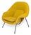 A striking contemporary photograph of the iconic Womb Chair, designed by Eero Saarinen in 1943. This sculptural mid-...