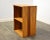 A modern small solid cherry & oak custom bookshelf by Larry Ross 1979. 21.25” wide. 14.75” deep. 28” tall.