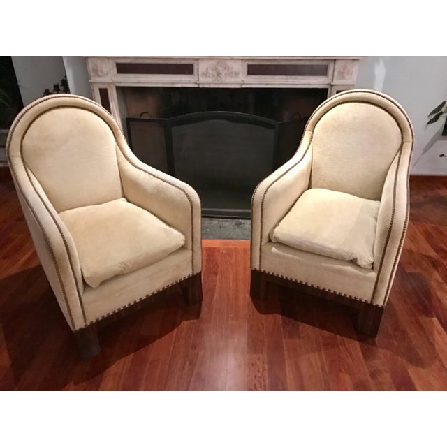 This elegant Pair of Mid-Century Modern Lounge Chairs with their high backs and deep seats are the place to mingle. Once...
