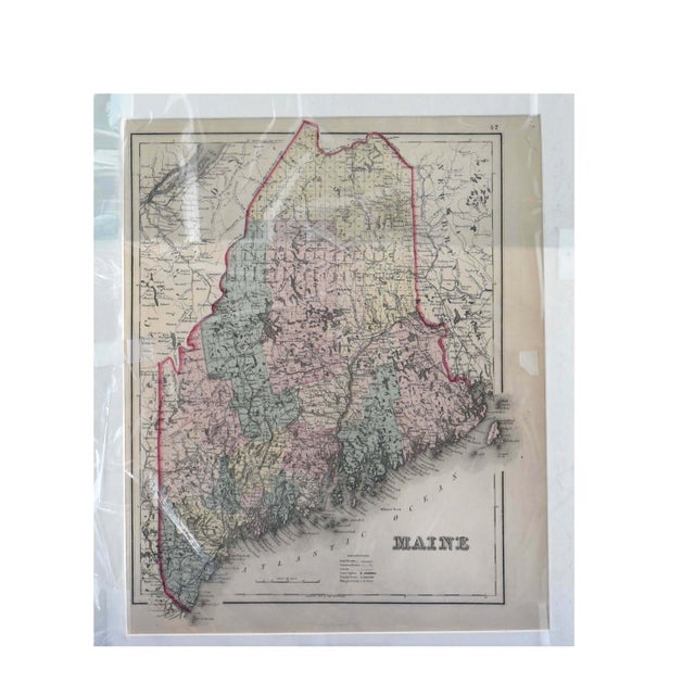 This is a fascinating antique two-sided map, measuring approximately 16" x 20", featuring detailed cartography of Maine on...