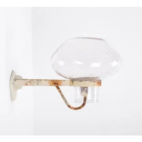 Wall lamp designed by Gunnar Asplund. Produced by ASEA in Sweden, 1950s. This piece is attributed to the mentioned...