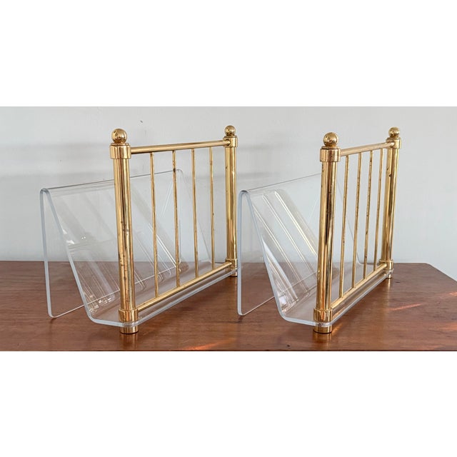 A pair of lucite and brass magazine or desk organizers, file holders straight out of the 1970s. Very decorative and...