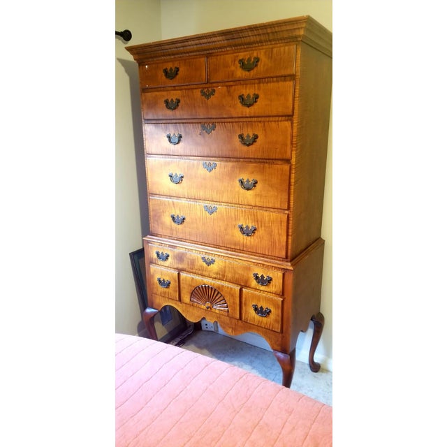 A spectacular, custom-crafted Queen Anne-style highboy chest featuring exceptional tiger (curly) maple wood grain...