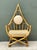 Inspired by the iconic designs of Henry Olko, this vintage loop rattan lounge chair embodies the relaxed sophistication of...