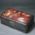 This beautifully crafted rectangular box features a striking two-tone design: a rich, textured black wood grain base with...