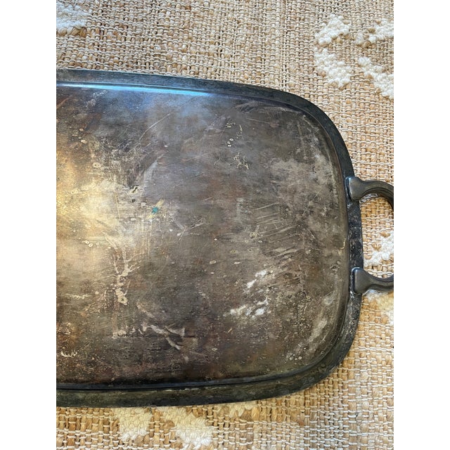 The Vintage Silver Plate Butler’s Tray with ornate floral engraving by Haddon is a decorative addition to any home. Made...