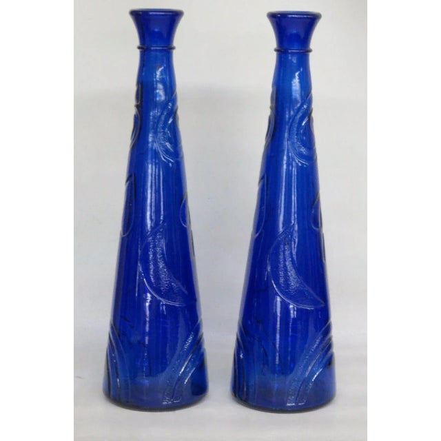 These beautiful tall Vases are made out of glass. This lovely vase pair was made by Studio Nova in West Germany, as...
