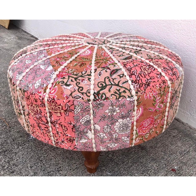 Wonderful large round pink puffy floral patchwork ottoman. Just Gorgeous! Wood legs. Solid and Sturdy. No damage of any...