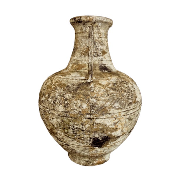 On offer is an amphora, an ancient Greek form. Such two-handled pots had a narrow neck accessing a larger bag-shape body....