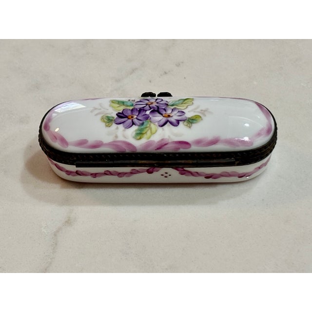 Pretty vintage Limoges box in purples and pinks to grace your shelves or side tables, or to add to an existing collection.