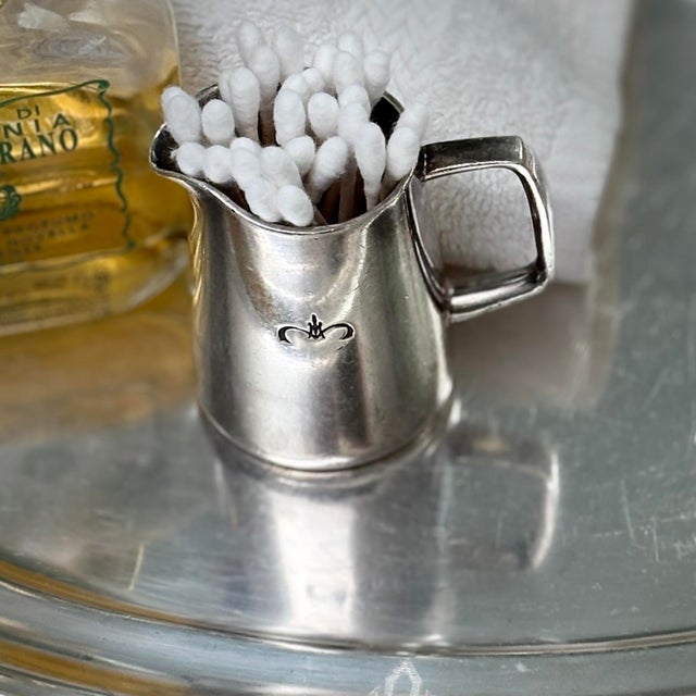 This timeless vintage 2-ounce silver-plated mini creamer by prestigious British silversmiths Mappin & Webb features an...