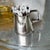 This timeless vintage 2-ounce silver-plated mini creamer by prestigious British silversmiths Mappin & Webb features an...
